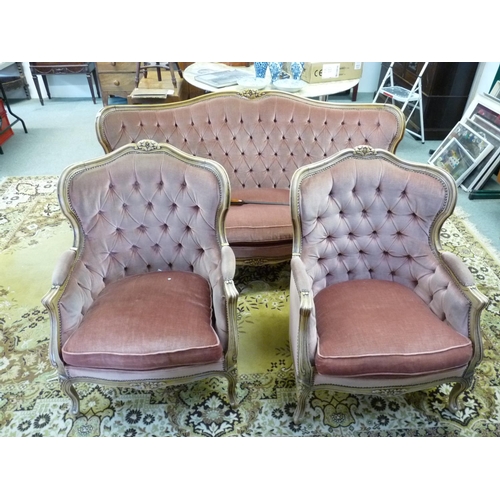 261 - 3 Piece 20thC French style sofa suite with button back upholstery and carved oak frame