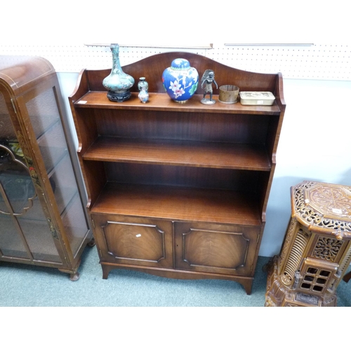 281 - 20thC Mahogany waterfall bookcase with cupboard base