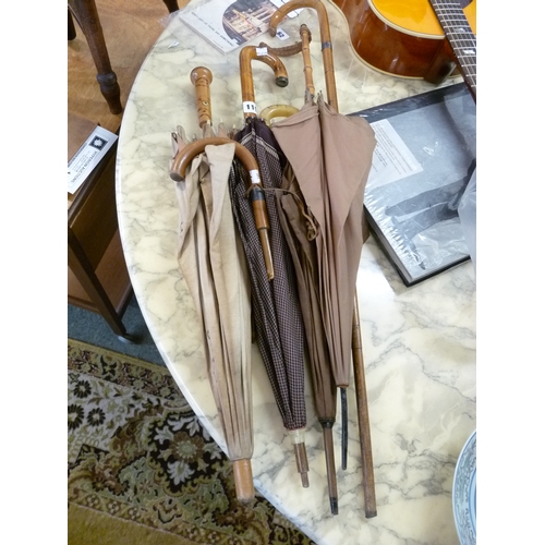 119 - Collection of assorted Edwardian and later umbrellas and walking canes