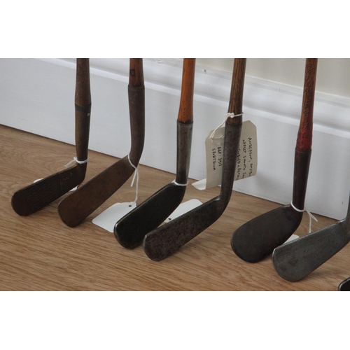 65 - Seven Hickory Shafted Golf Clubs to include Tom Stewart smooth faced cleek; Anderson of Anstruther (... 