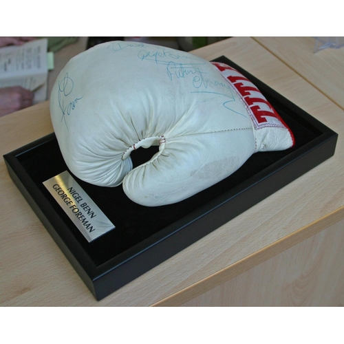 83 - A full size Title boxing glove personally signed by George Foreman and a young Nigel Benn who signs ... 