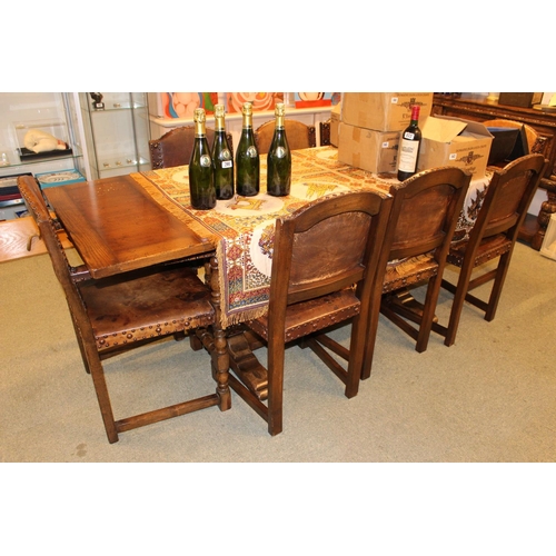 366 - Good Quality Oak Reproduction Draw leaf dining table with a set of 6 Studded Leather Chairs