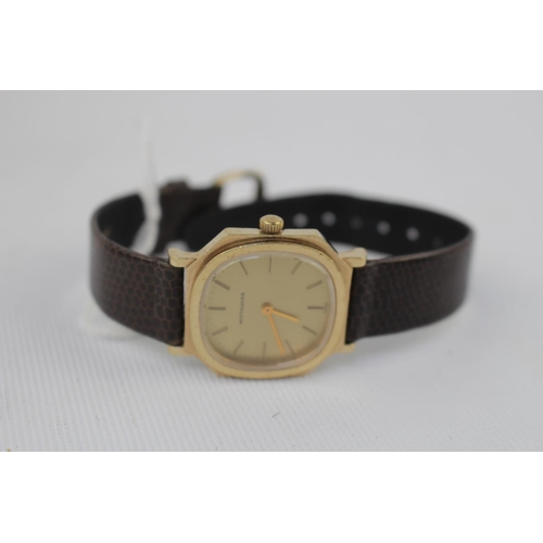 323 - Wittnauer Gilt faced wristwatch with baton dial and Leather strap