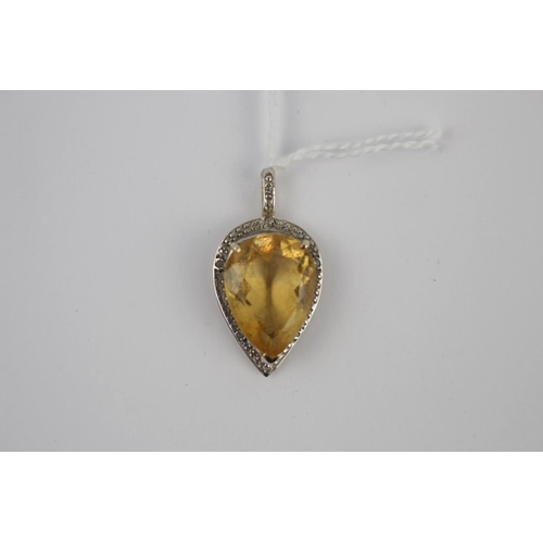 338 - Ladies 9ct Gold Citrine set Pear shaped pendant in milligrain set surround 4.5g total weight