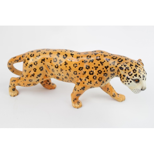 99 - Large Beswick of a prowling Leopard with circular stamp to base