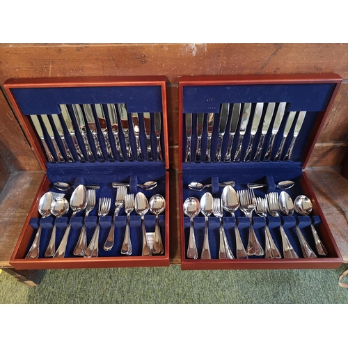 186 - 2x stainless steel cutlery sets in wooden cases.