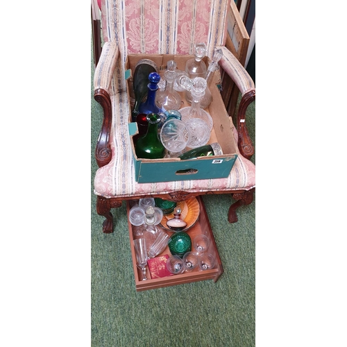 219 - Two boxes of glassware including cut glass decanters, art glass and glass sets.