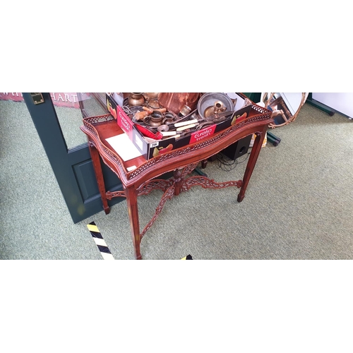 422 - Victorian mahogany silver table with intricate carved trestle detail.