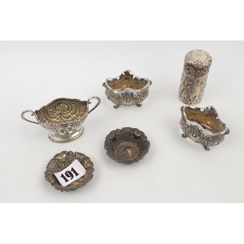 191 - Collection of White metal highly foliate decorated Silver ware inc. Perfume bottle holder, Cruets et... 