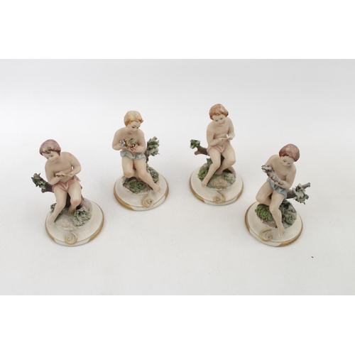 97 - Set of 4 Capodimonte Maria Augela Putti figures of classical design