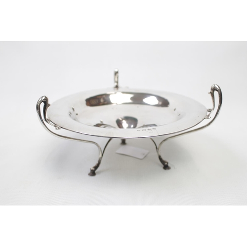 148 - Edwardian Shallow Dish with three shaped scroll handles forming a tri-form base supported on pad fee... 