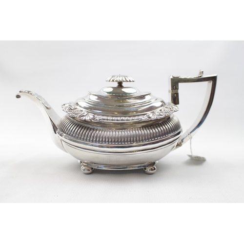 156 - George III Boat Shaped Silver Teapot with scallop shell and ribbed decoration, supported on ball fee... 