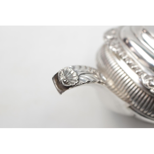 156 - George III Boat Shaped Silver Teapot with scallop shell and ribbed decoration, supported on ball fee... 