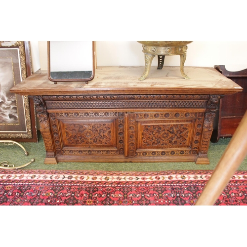 295 - Interesting Late 19thC Oak carved 2 door cabinet with lions head drop and panel doors 140cm in Width