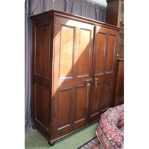 299 - Large Georgian Oak 2 door Cabinet with panelled front and brass handles