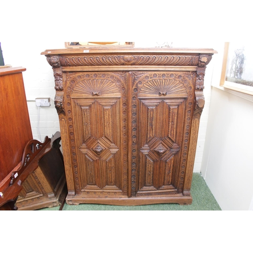 313 - Large 19thC Carved Oak Continental 2 door cabinet with figural pillars