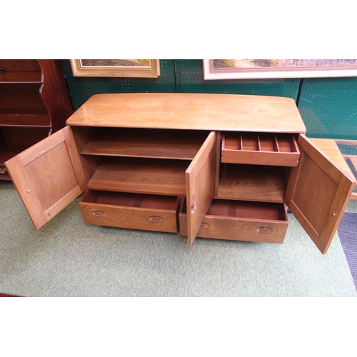 339 - Ercol 3 door 1960s blue label period light wood sideboard on casters in good condition