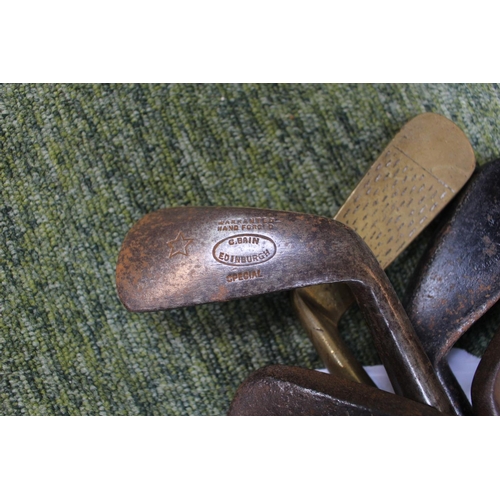 91 - Collection of Vintage Golf Clubs inc. W M Gibson, Fife, and unusual left hand iron, Machie and G Bai... 