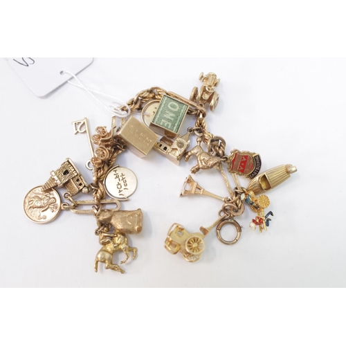 360 - Ladies 9ct Gold Charm bracelet with assorted charms 54g total weight