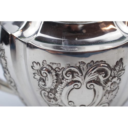 104 - Late Victorian Silver Oval boat shaped Teapot with embossed foliate decoration by John Millward Bank... 