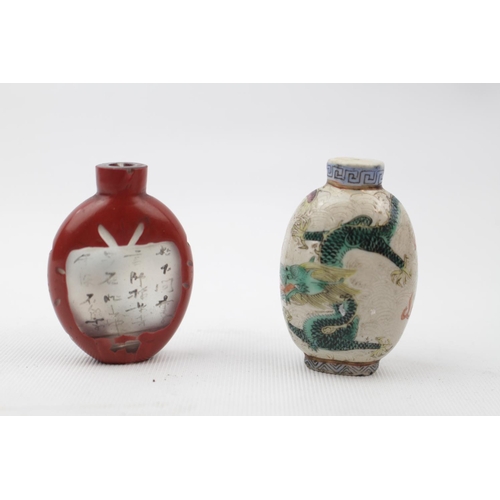 66 - 19thC Porcelain Chinese Dragon decorated Snuff bottle with greek key neck and a Glass overlay inside... 