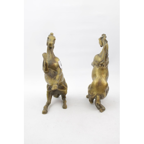 71 - Pair of Very Heavy Cast Brass rearing horses, 22cm in height