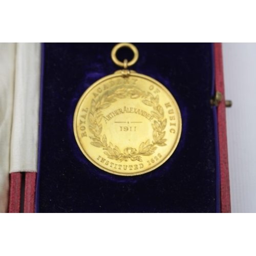 182 - 2 Cased John Pinches Medallist of London Silver Royal Academy of Music White metal medal and a Gilt ... 