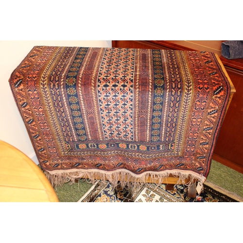 560 - Mid 20thC Red ground Persian rug with Tassel ends