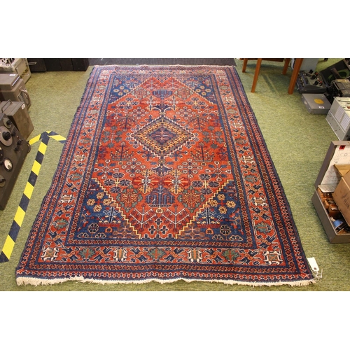 561 - Early 20thC Turkish Red and Blue ground rug with central medallion 210 x 133cm