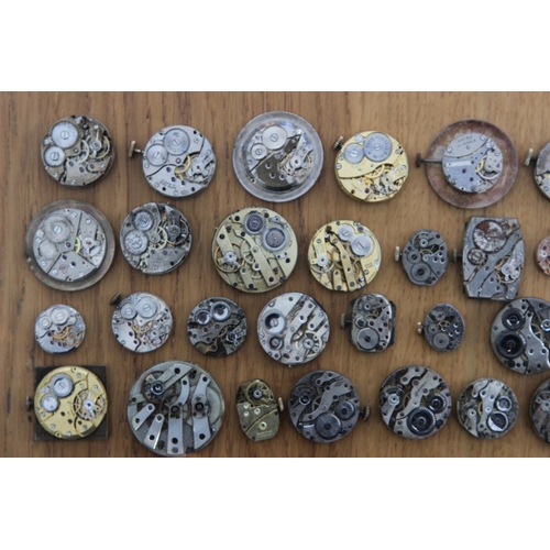 232f - Collection of 44 Watch Movements & Faces inc Janex, Exactus and Lindex. Watch movements and faces in... 