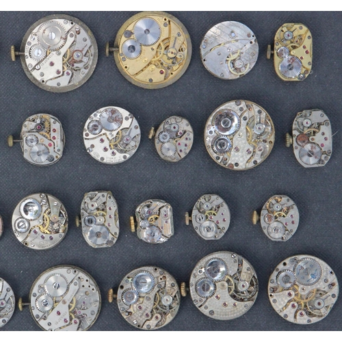 232j - Collection of 39 Watch Movements & Faces inc Trojan, Omega & Eros. Watch movements inc Trojan, Thoma... 