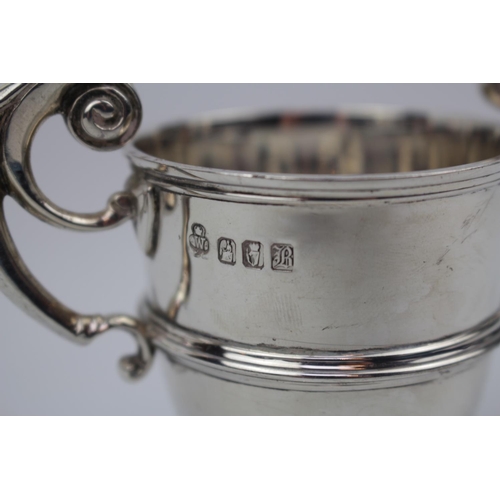 101 - Heavy gauge Silver Trophy with double scroll handle by West & Son of Dublin 1897. 140g total weight