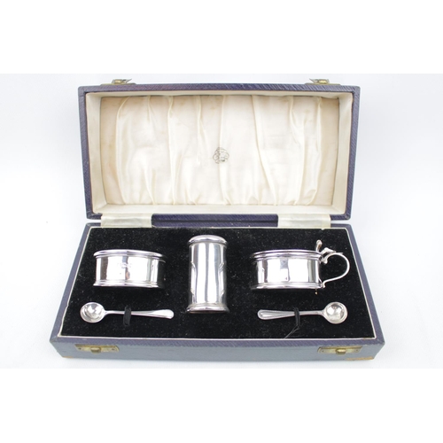 109 - Good quality Cased Silver cruet set of cylindrical form with 2 spoons, London 1947, Retailed by Reed... 