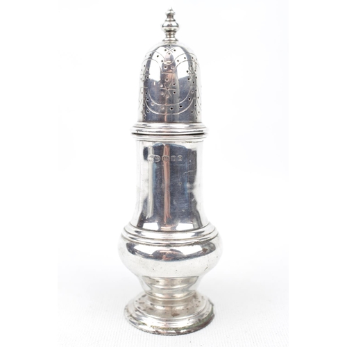 133 - A Silver Georgian style caster with baluster finial 14cm high, London 1935. 111g total weight