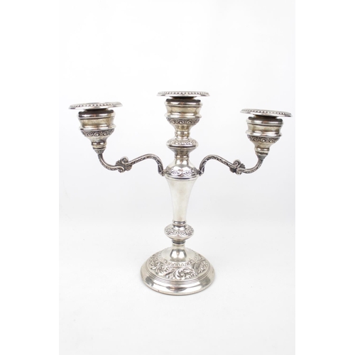 137 - A Silver mounted candelabra with scroll decoration 24cm in Height, Birmingham 1973