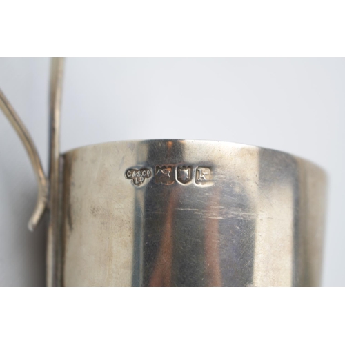 139 - A Silver cup holder with loop handle London1909 by The Goldsmiths & Silversmiths Company. 77g total ... 