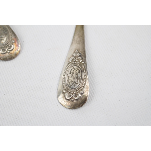 144 - A set of 12 Silver French small dessert spoons with applied decoration - 295g total weight