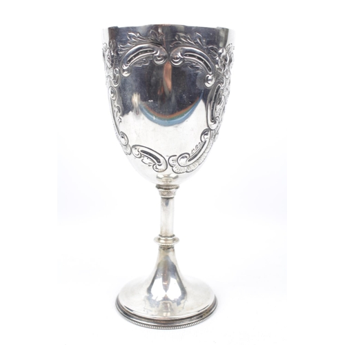 149 - An embossed Silver scroll decorated goblet on spreading base, 21.5cm in Height, Sheffield 1905 by Ma... 