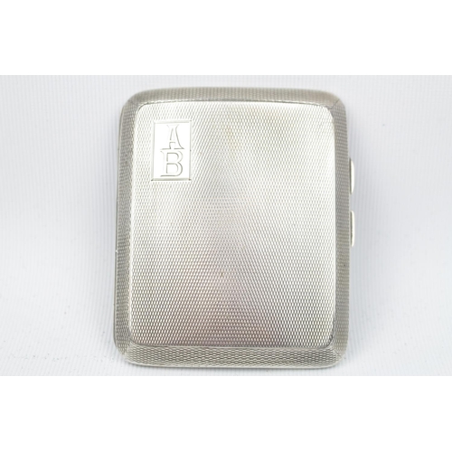 160 - A Silver engine turned cigarette case of curved outline, Chester 1928 by T Nightingale & Son. 85g to... 