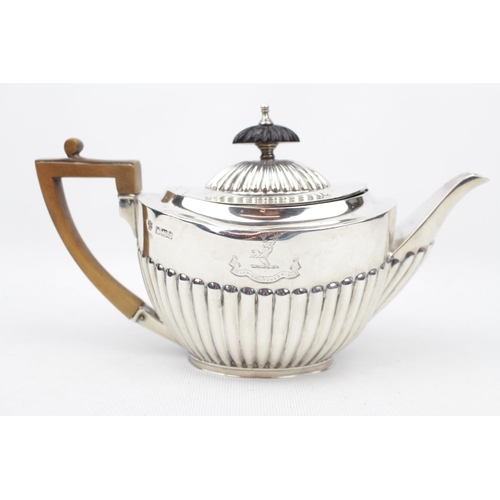 172 - An oval boat-shaped Silver part-fluted teapot on rim foot, Sheffield 1893 by Goldsmiths & Silversmit... 