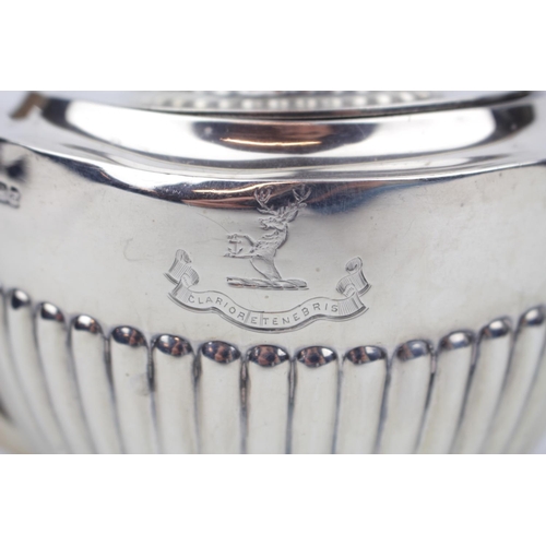 172 - An oval boat-shaped Silver part-fluted teapot on rim foot, Sheffield 1893 by Goldsmiths & Silversmit... 