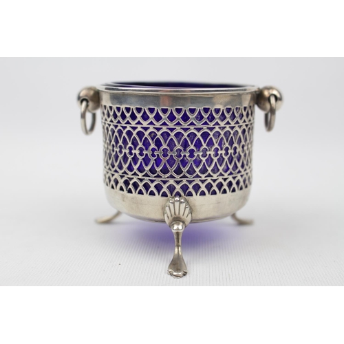 182 - A Silver circular bowl with pierced side and blue glass liner on three pad feet, 7cm in Height, Birm... 