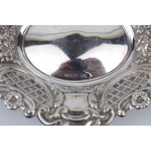 186 - A Mid 20thC Silver embossed oval sweet dish with pierced body, 15cm in Diameter, London 1958. 85g to... 