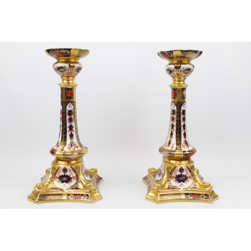 214 - Pair of Royal Crown Derby 1128 pattern Castleton candlestick XXXIX, Out swept square base, 26.5cm to... 