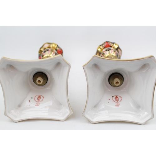 214 - Pair of Royal Crown Derby 1128 pattern Castleton candlestick XXXIX, Out swept square base, 26.5cm to... 