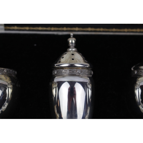 28 - George V Boxed Silver 3 Piece Cruet set of Celtic rim design by Ernest W Haywood, Birmingham 1936