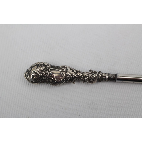 77 - Good Quality cased Button hook and puller set with Silver embossed handles, Birmingham 1895