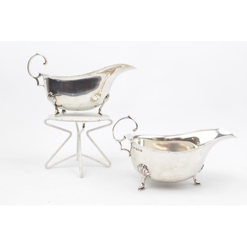 82 - Pair of George V Silver Sauce Boats of Georgian design on pad feet and scroll handle, Birmingham 193... 