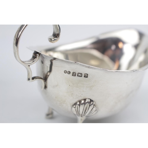 82 - Pair of George V Silver Sauce Boats of Georgian design on pad feet and scroll handle, Birmingham 193... 