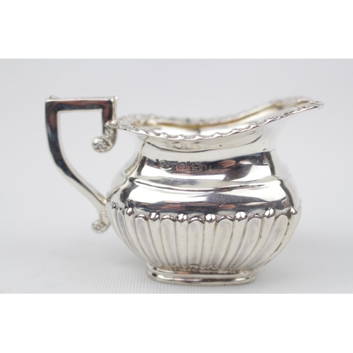 83 - Good Quality Silver Cream Jug with reed decoration by William Aitken, Birmingham 1910, 84g total wei... 